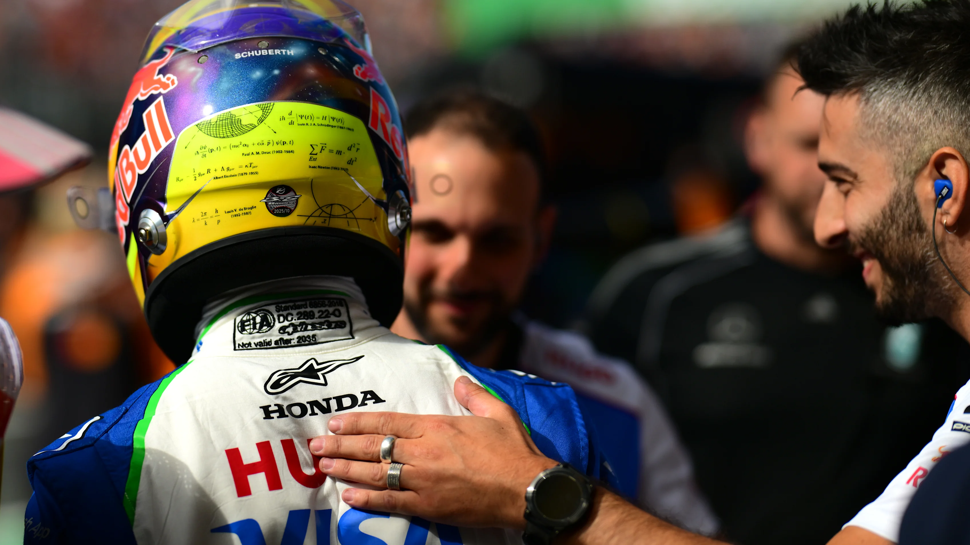 ZANDVOORT, NETHERLANDS - AUGUST 30: Fourth placed qualifier Isack Hadjar of France and Visa Cash App Racing Bulls is congratulated by teammates in parc ferme during qualifying ahead of the F1 Grand Prix of Netherlands at Circuit Zandvoort on August 30, 2025 in Zandvoort, Netherlands. (Photo by Mario Renzi - Formula 1/Formula 1 via Getty Images)