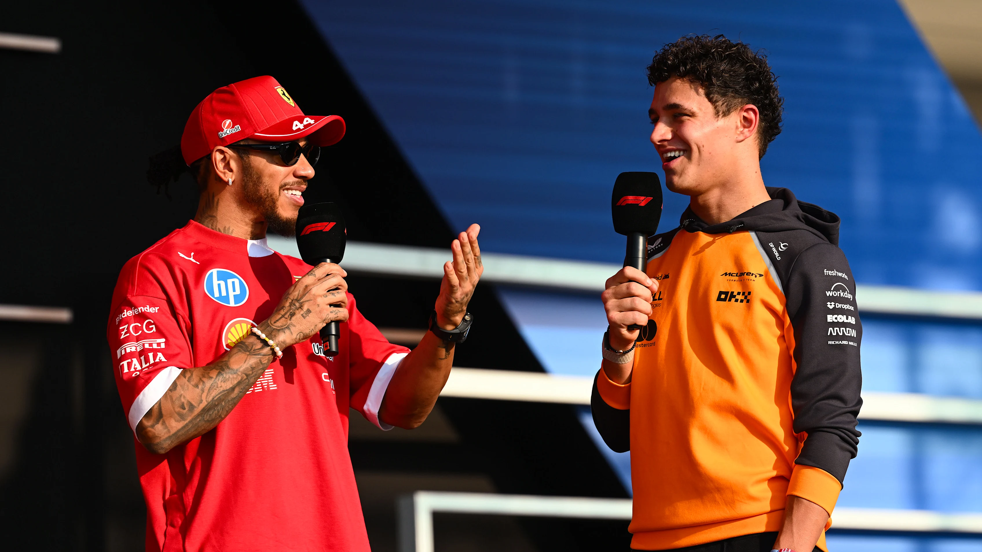 LUSAIL CITY, QATAR - NOVEMBER 28: Lewis Hamilton of Great Britain and Scuderia Ferrari and Lando