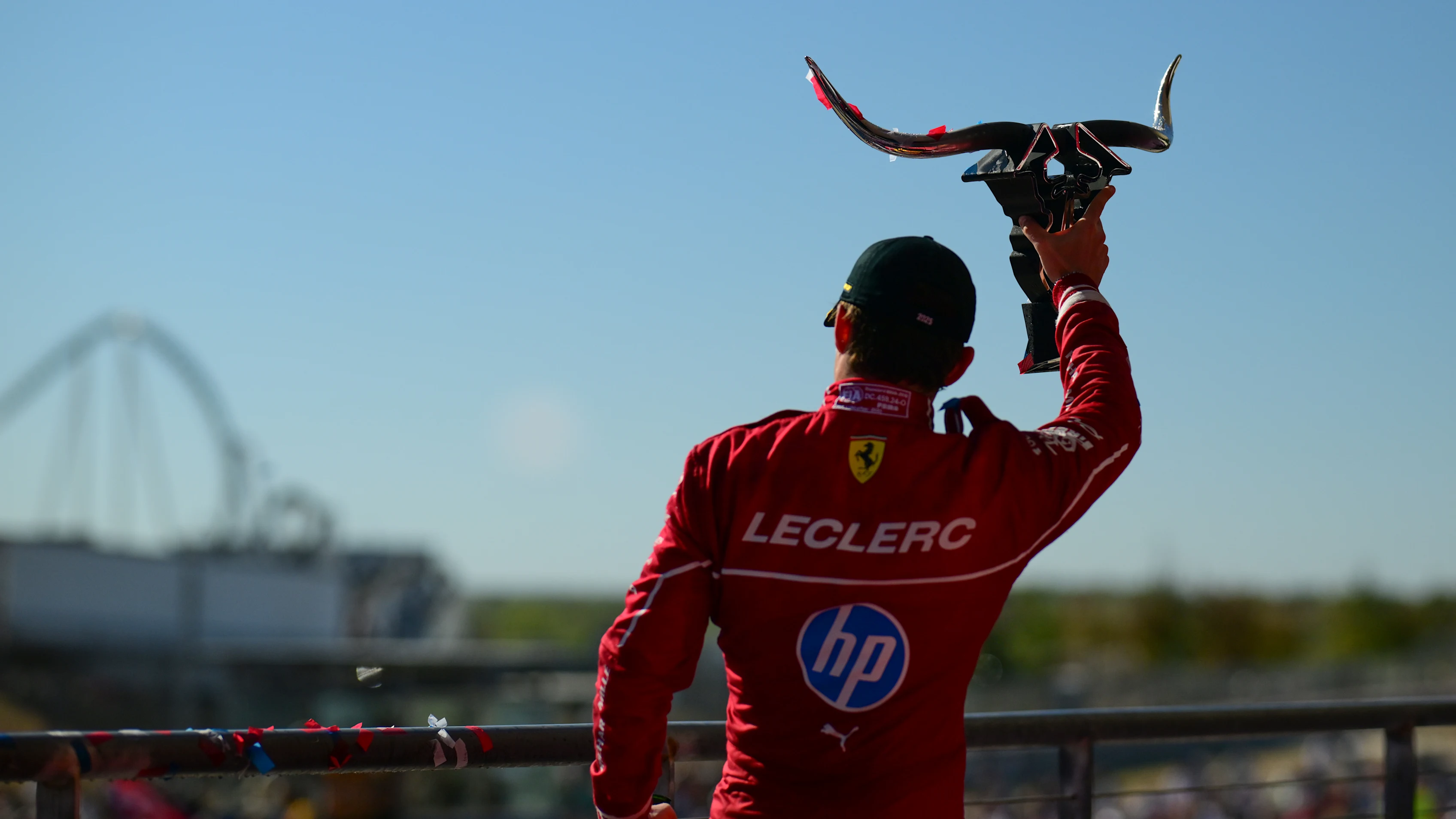 AUSTIN, TEXAS - OCTOBER 19: Third placed Charles Leclerc of Monaco and Scuderia Ferrari leaves the podium with his trophy during the F1 Grand Prix of United States at Circuit of The Americas on October 19, 2025 in Austin, Texas. (Photo by Mario Renzi - Formula 1/Formula 1 via Getty Images)