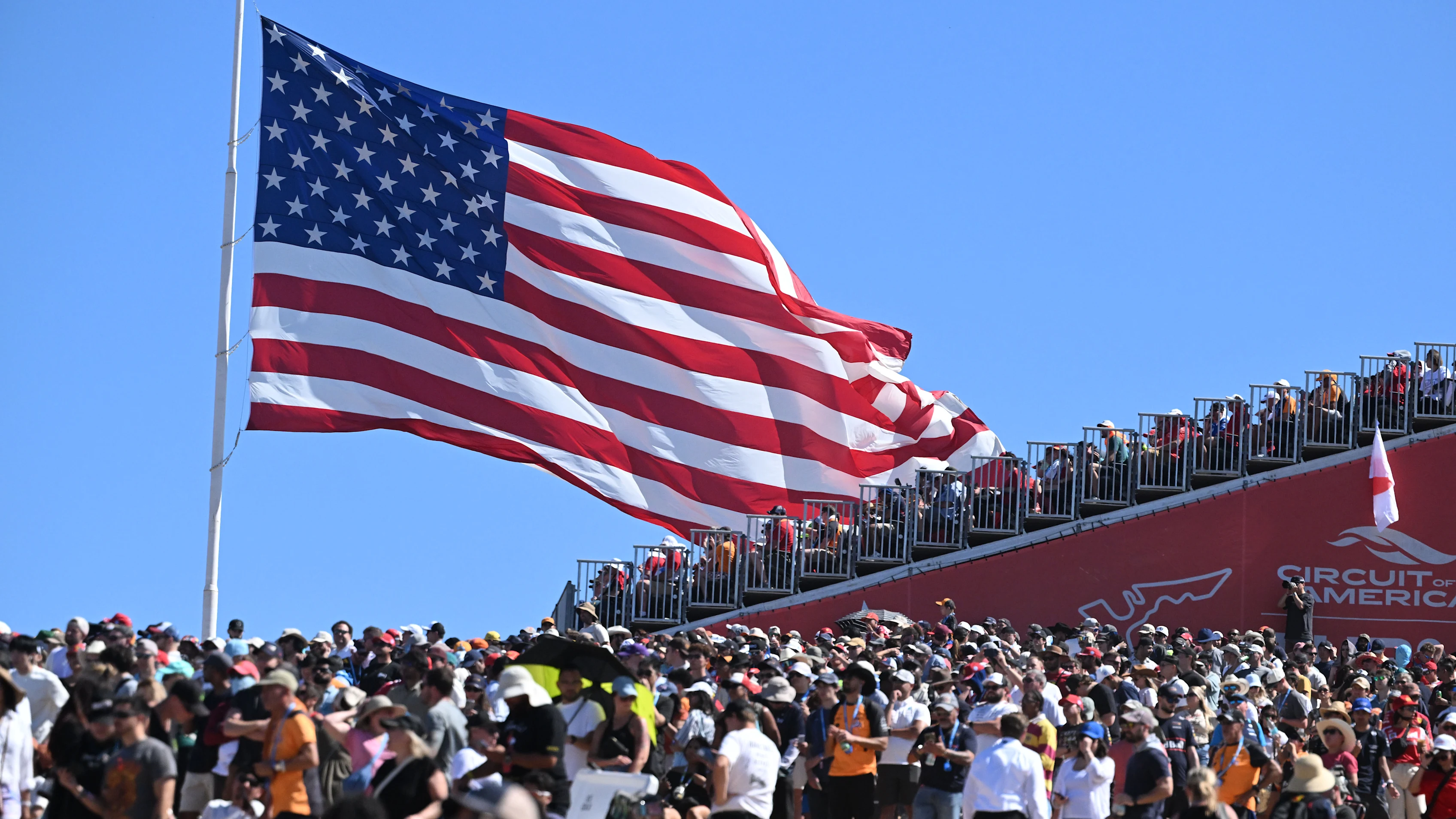 AUSTIN, TEXAS - OCTOBER 19: A huge crowd and huge US flag during the F1 Grand Prix of United States