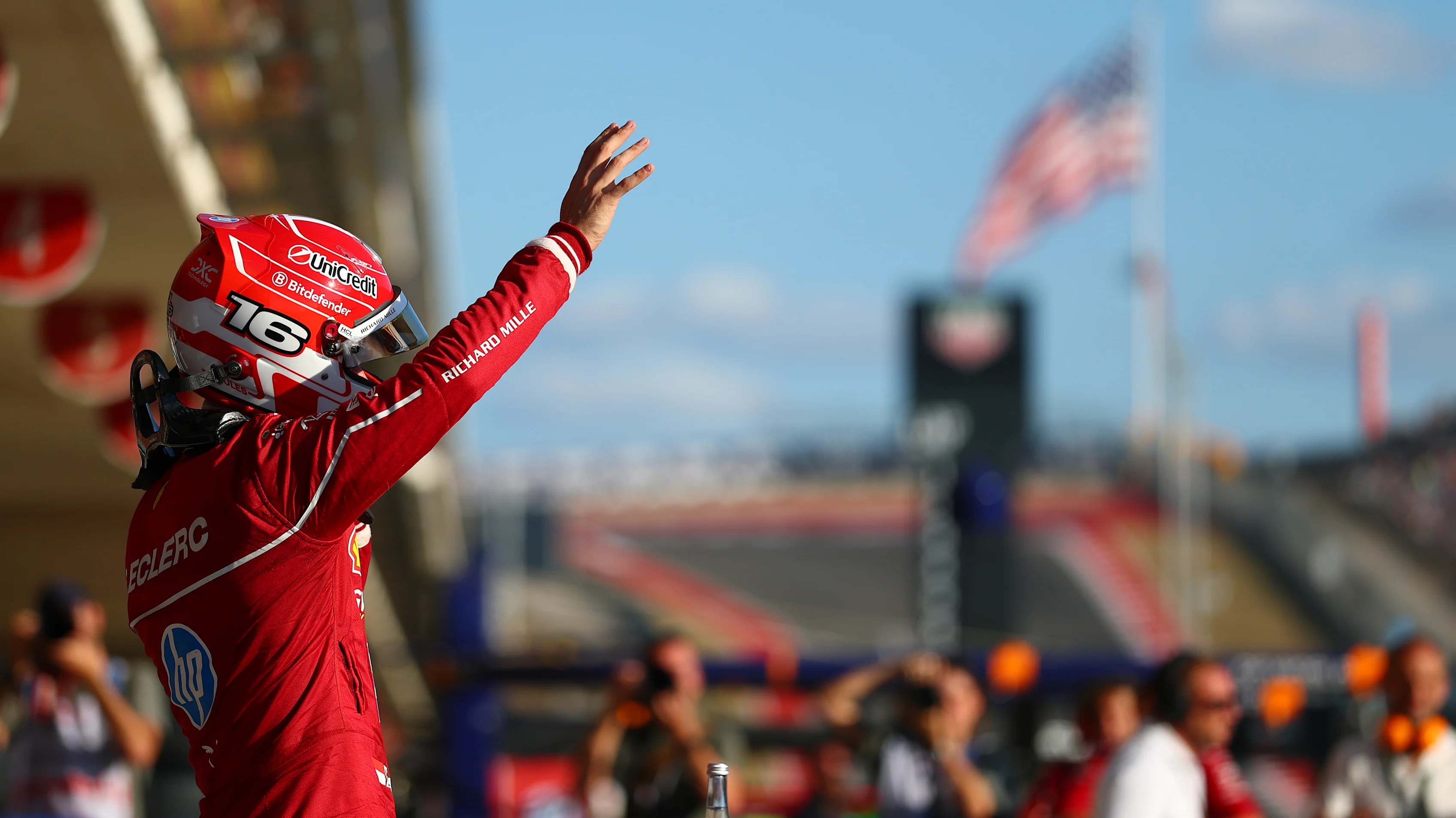 AUSTIN, TEXAS - OCTOBER 18: Third placed qualifier Charles Leclerc of Monaco and Scuderia Ferrari waves in parc ferme during Qualifying ahead of the F1 Grand Prix of United States at Circuit of The Americas on October 18, 2025 in Austin, Texas. (Photo by Bryn Lennon - Formula 1/Formula 1 via Getty Images)