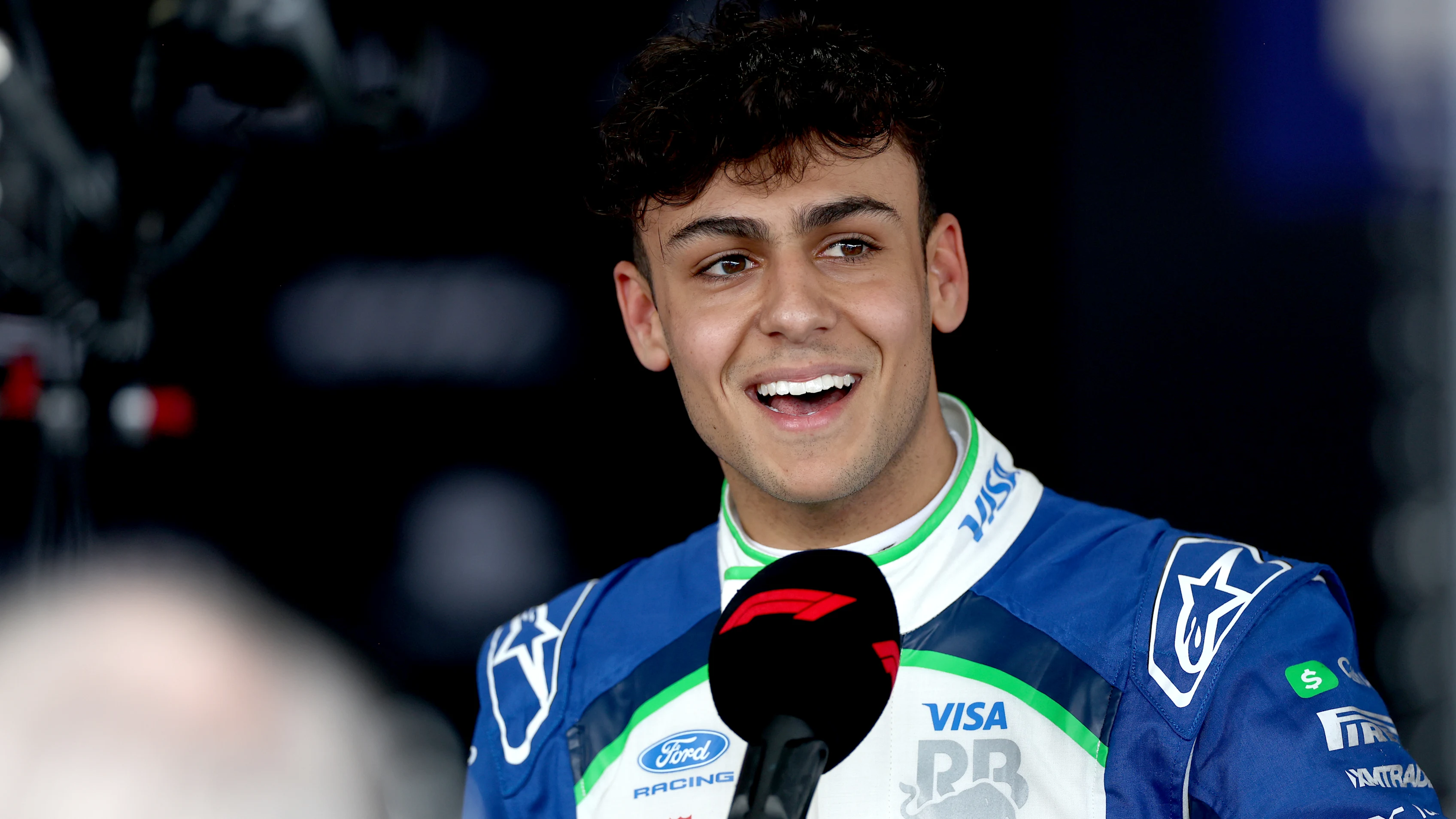 MELBOURNE, AUSTRALIA - MARCH 07: Ninth placed qualifier Arvid Lindblad of Great Britain and Visa Cash App Racing Bulls is interviewed during qualifying ahead of the F1 Grand Prix of Australia at Albert Park Grand Prix Circuit on March 07, 2026 in Melbourne, Australia. (Photo by Peter Fox/Getty Images)
