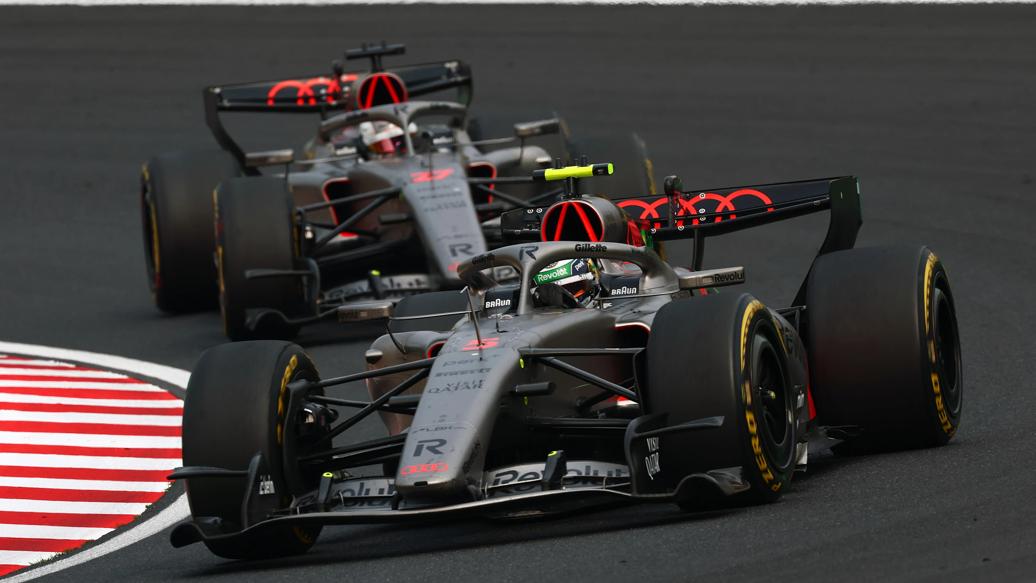 SUZUKA, JAPAN - MARCH 29: Gabriel Bortoleto of Brazil driving the (5) Audi F1 Team R26 leads Nico Hulkenberg of Germany driving the (27) Audi F1 Team R26 on track during the F1 Grand Prix of Japan at Suzuka Circuit on March 29, 2026 in Suzuka, Japan. (Photo by Clive Rose - Formula 1/Formula 1 via Getty Images)