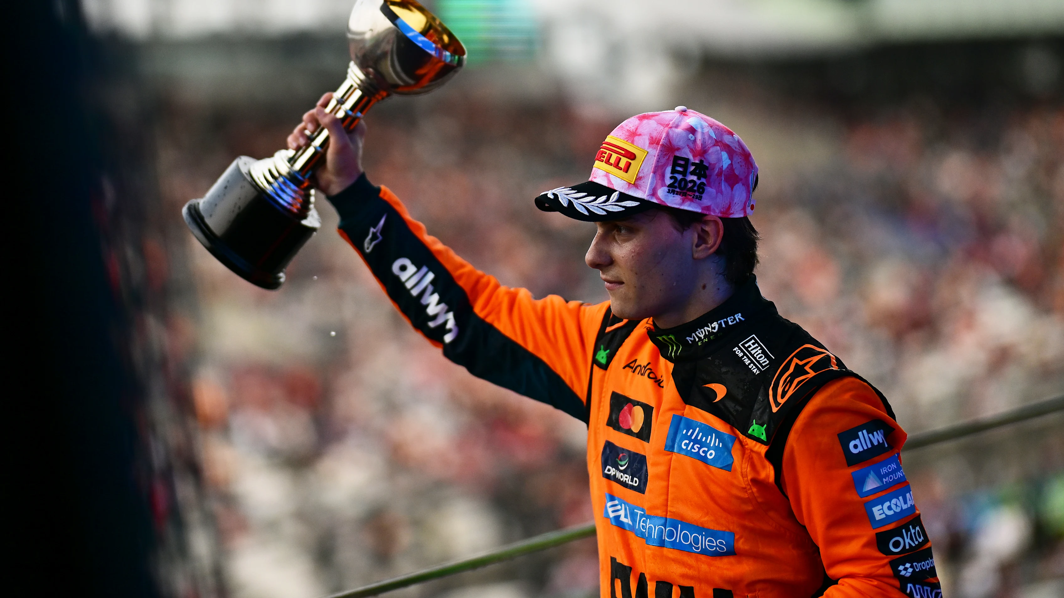 SUZUKA, JAPAN - MARCH 29: Second placed Oscar Piastri of Australia and McLaren lifts his trophy on the podium during the F1 Grand Prix of Japan at Suzuka Circuit on March 29, 2026 in Suzuka, Japan. (Photo by Mario Renzi - Formula 1/Formula 1 via Getty Images)