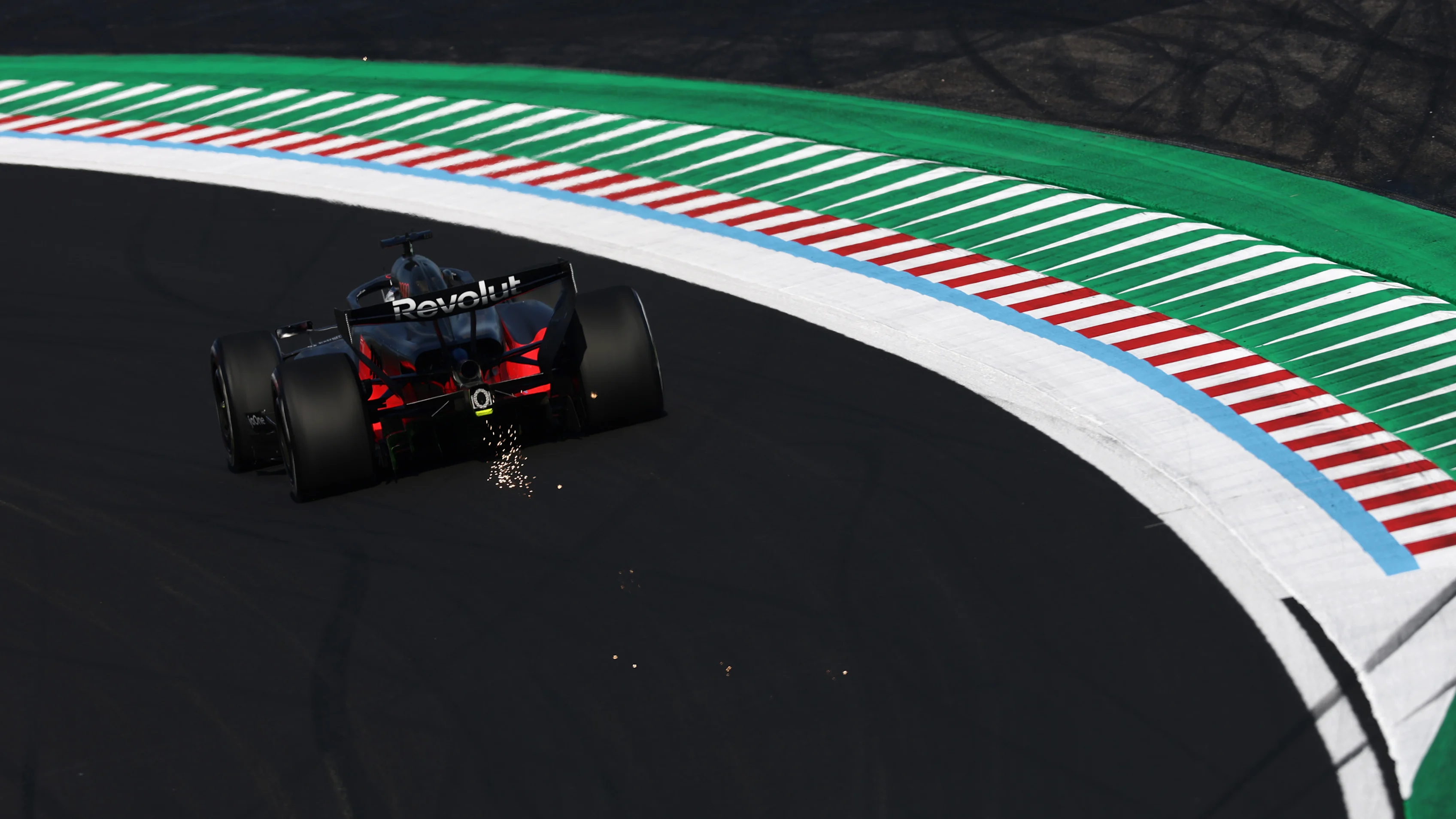 SUZUKA, JAPAN - MARCH 27: Sparks fly behind Nico Hulkenberg of Germany driving the (27) Audi F1 Team R26 on track during practice ahead of the F1 Grand Prix of Japan at Suzuka Circuit on March 27, 2026 in Suzuka, Japan. (Photo by Mark Thompson/Getty Images)