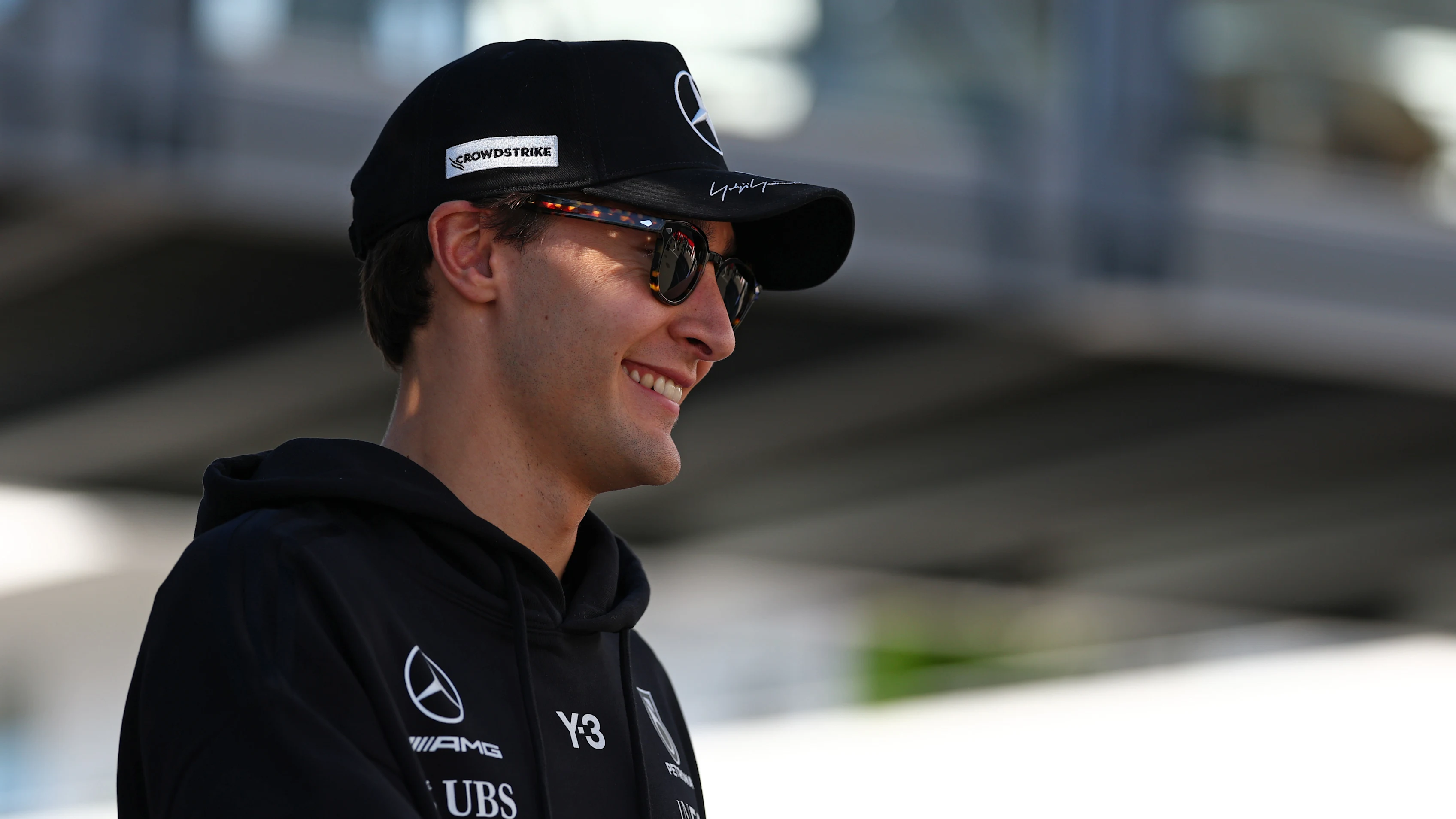SUZUKA, JAPAN - MARCH 26: George Russell of Great Britain and Mercedes AMG Petronas F1 Team walks