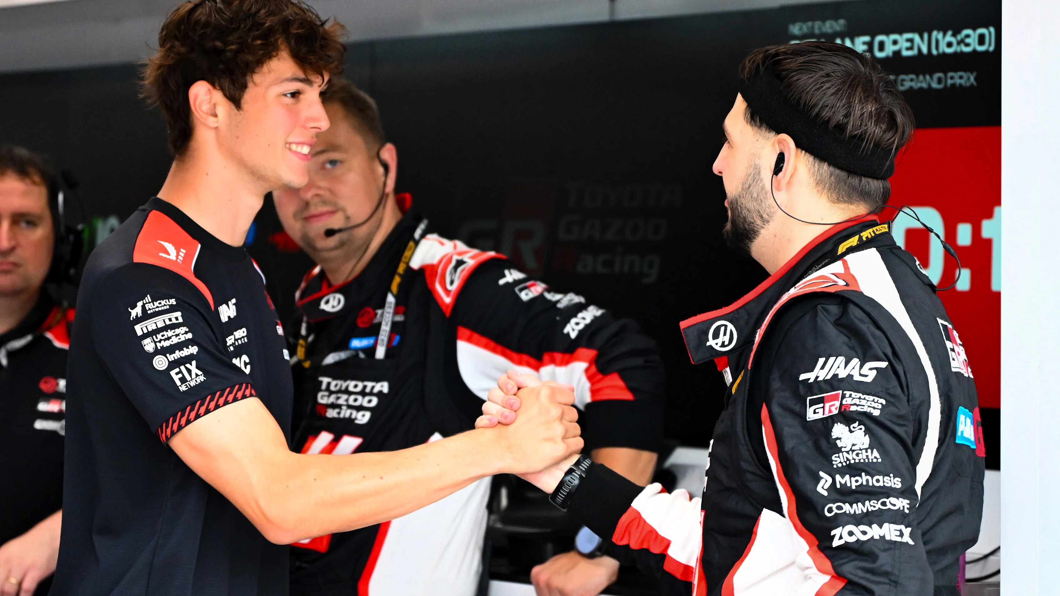SINGAPORE, SINGAPORE - OCTOBER 10: Oliver Bearman of Great Britain and Haas F1 in the garage with