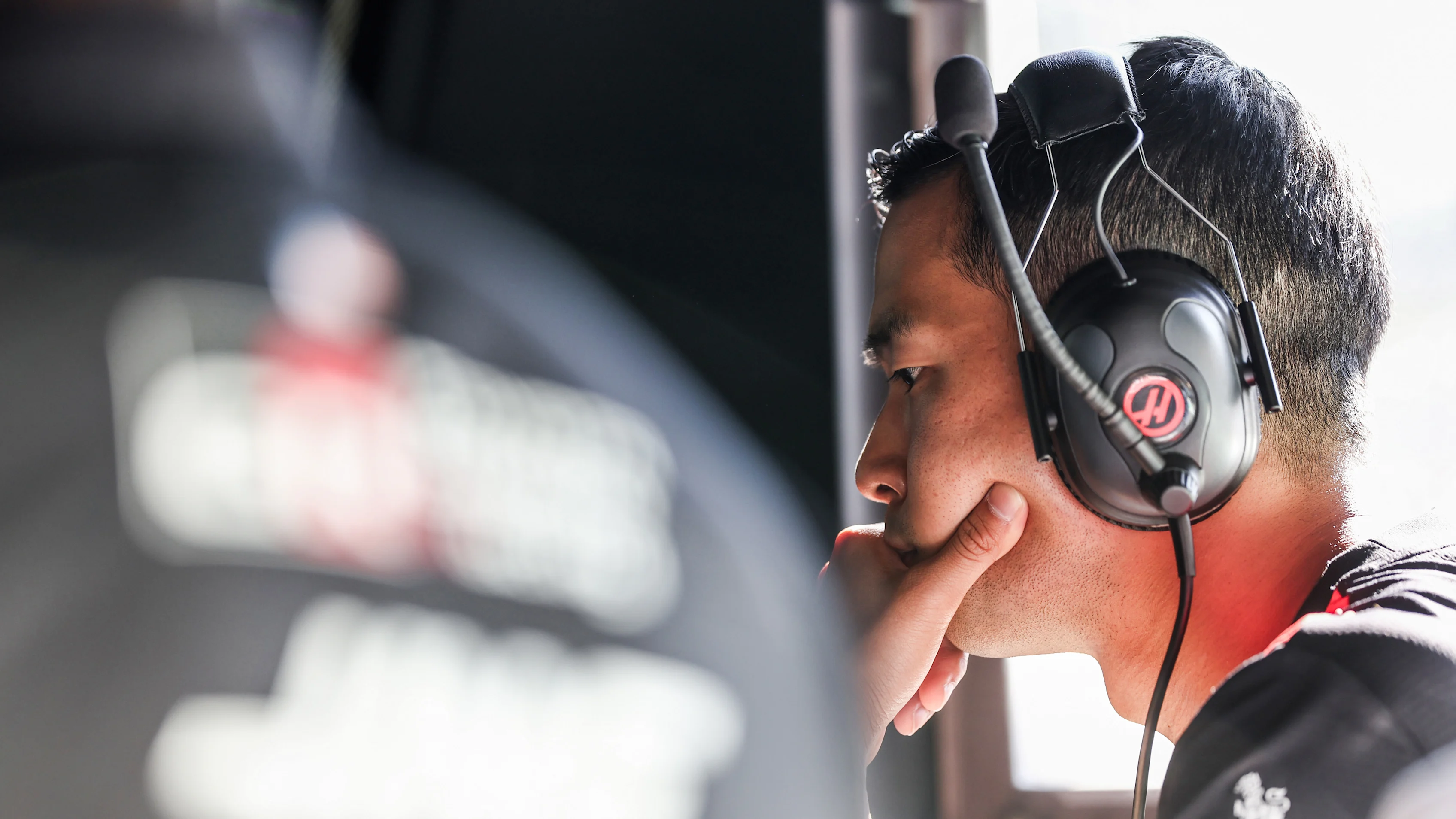 SPIELBERG, AUSTRIA - JUNE 26: Ryo Hirakawa of Japan and Haas F1 looks on in the garage during