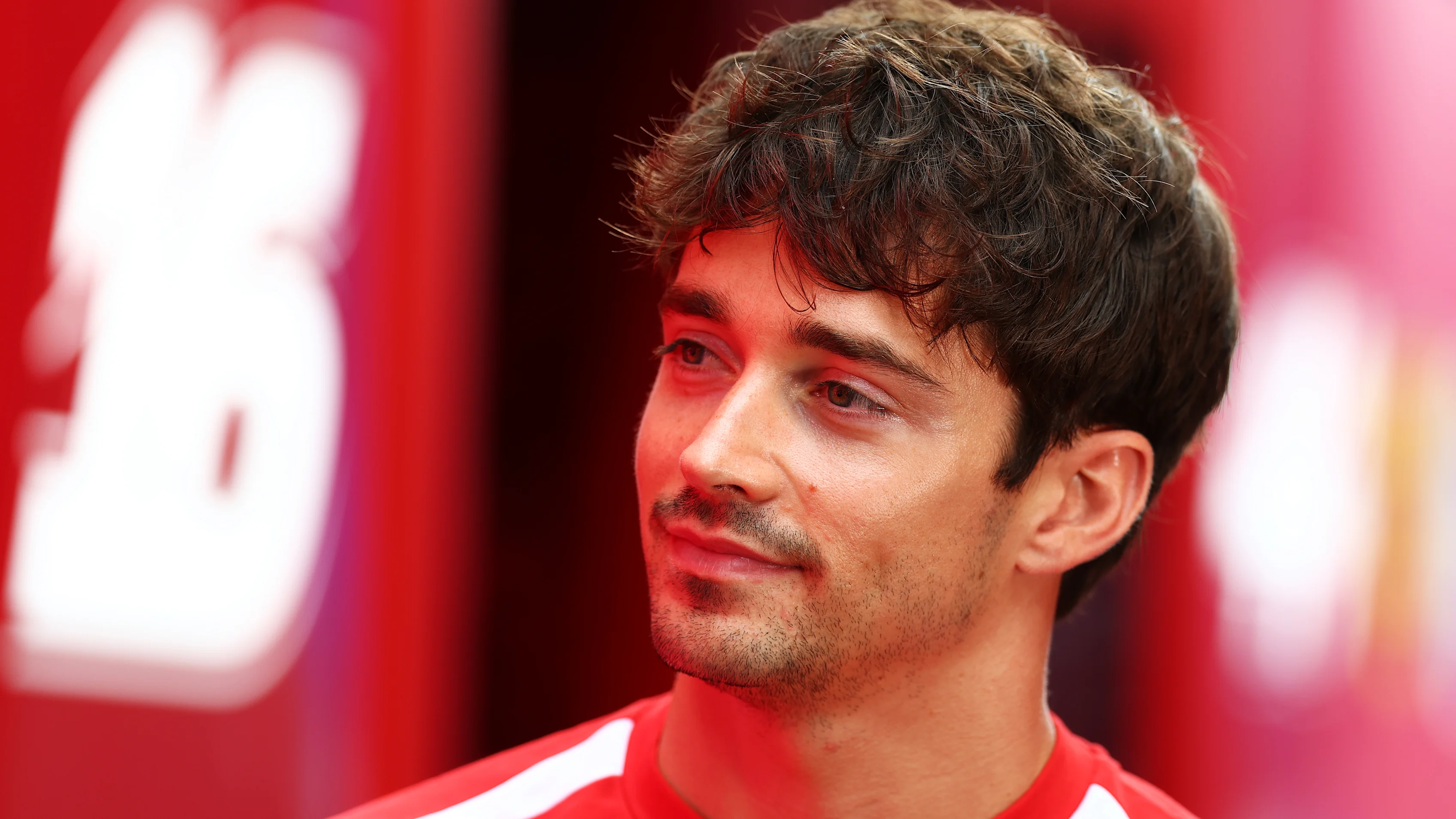 SPA, BELGIUM - JULY 16: Charles Leclerc of Monaco and Scuderia Ferrari looks on in the Paddock