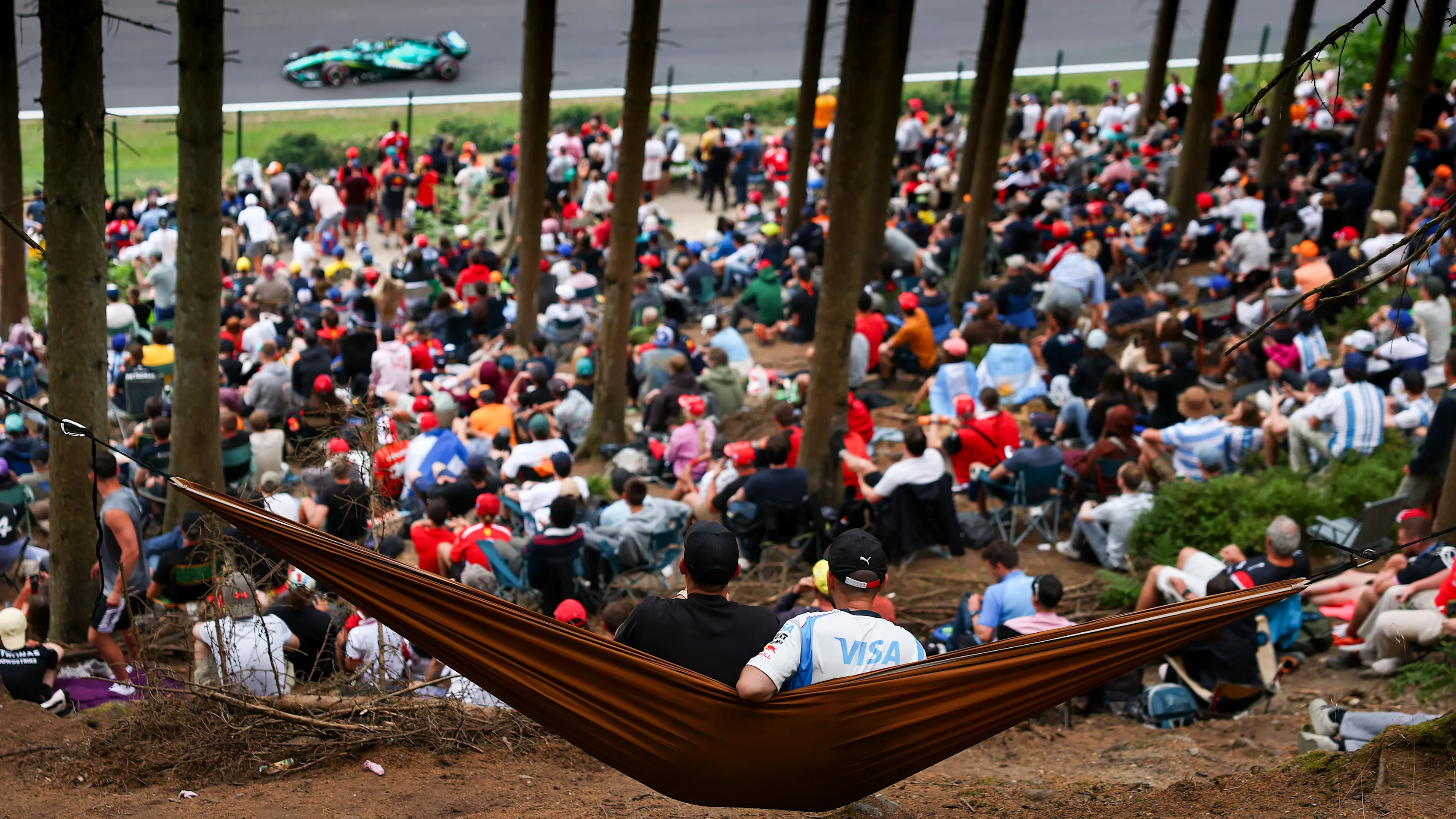 SPA, BELGIUM - JULY 18: Fans watch from a hammock as Lance Stroll of Canada driving the (18) Aston