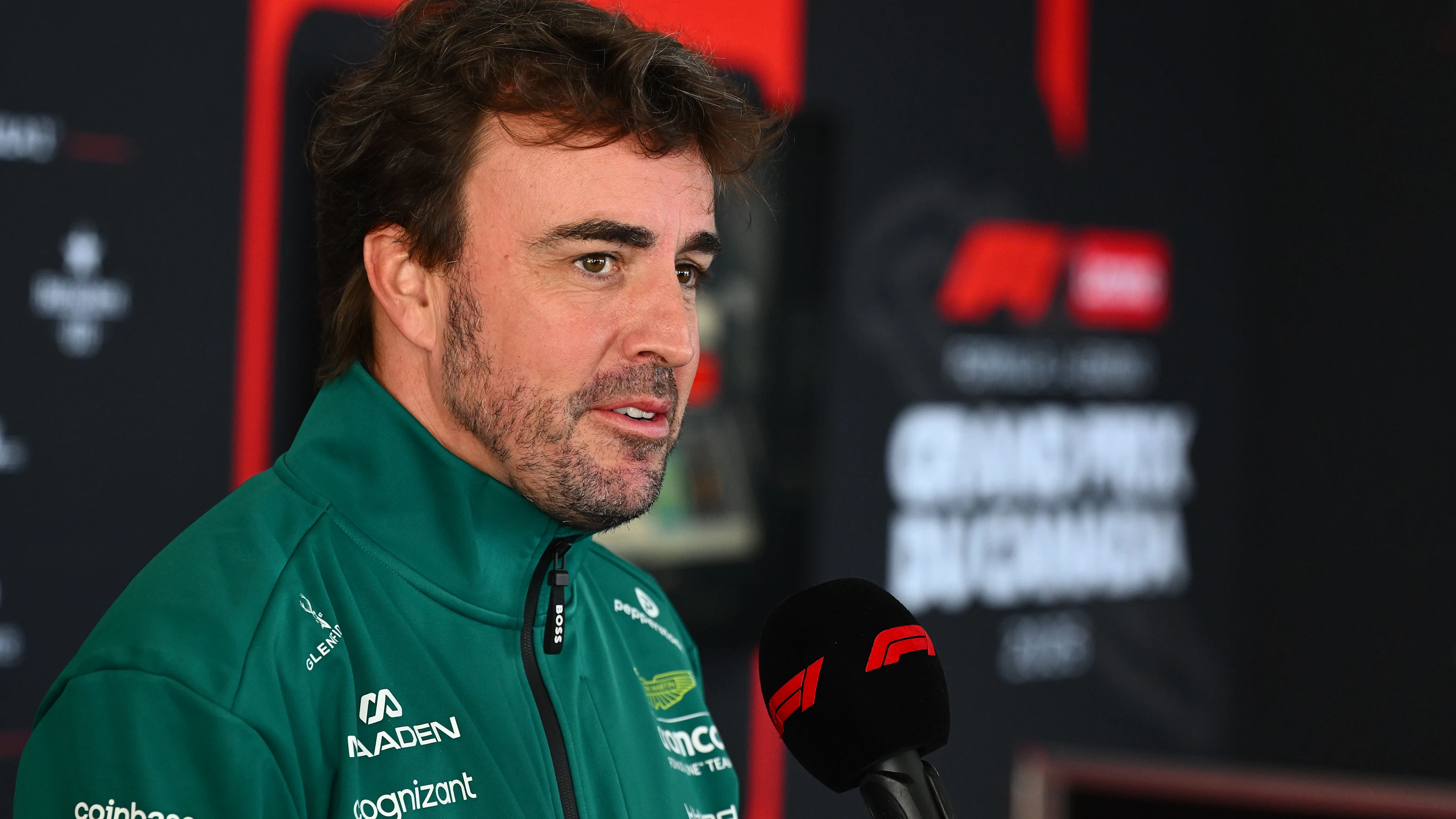MONTREAL, QUEBEC - MAY 21: Fernando Alonso of Spain and Aston Martin F1 Team talks to the media