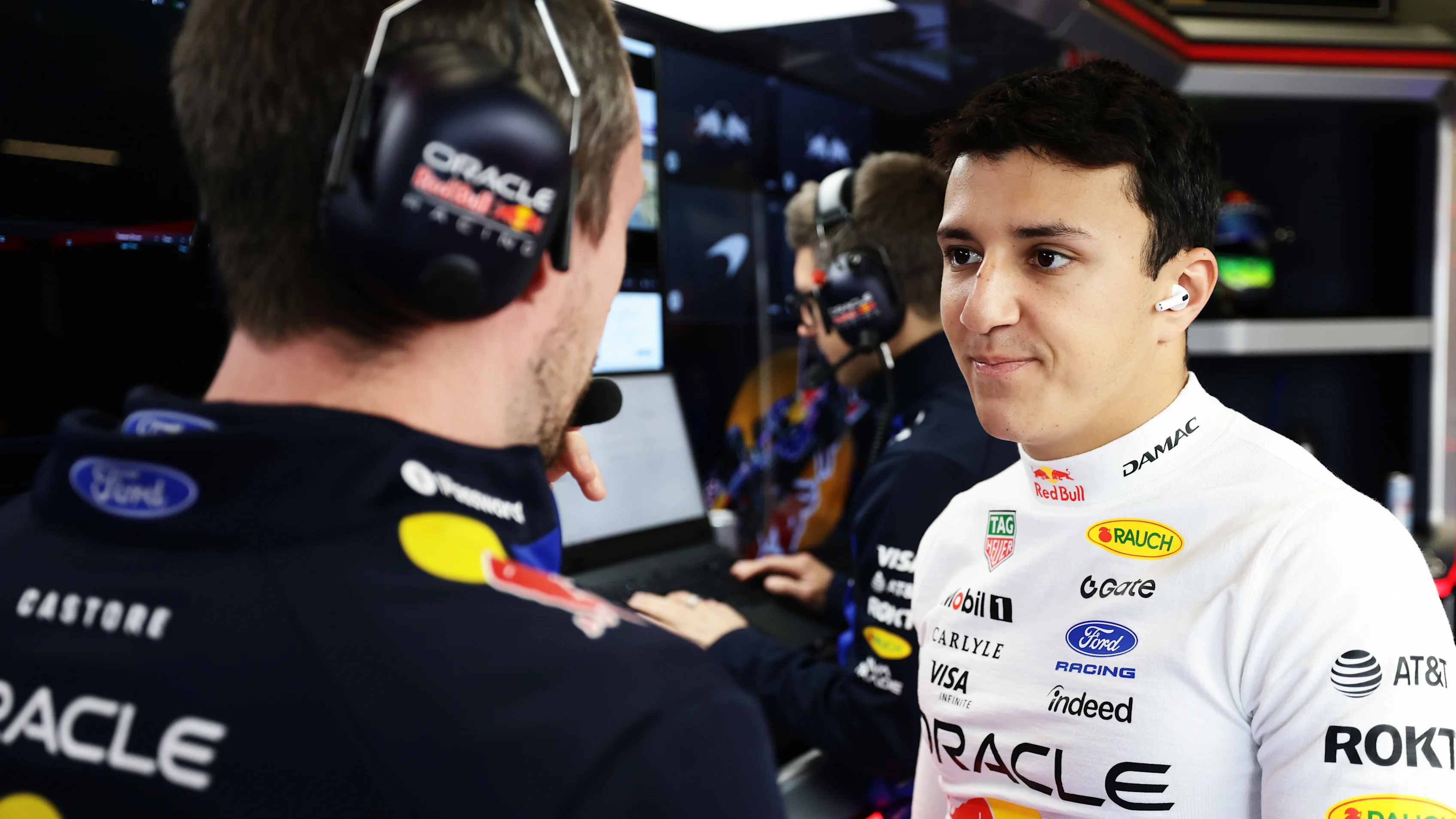 NORTHAMPTON, ENGLAND - JULY 04: Isack Hadjar of France and Oracle Red Bull Racing talks in the