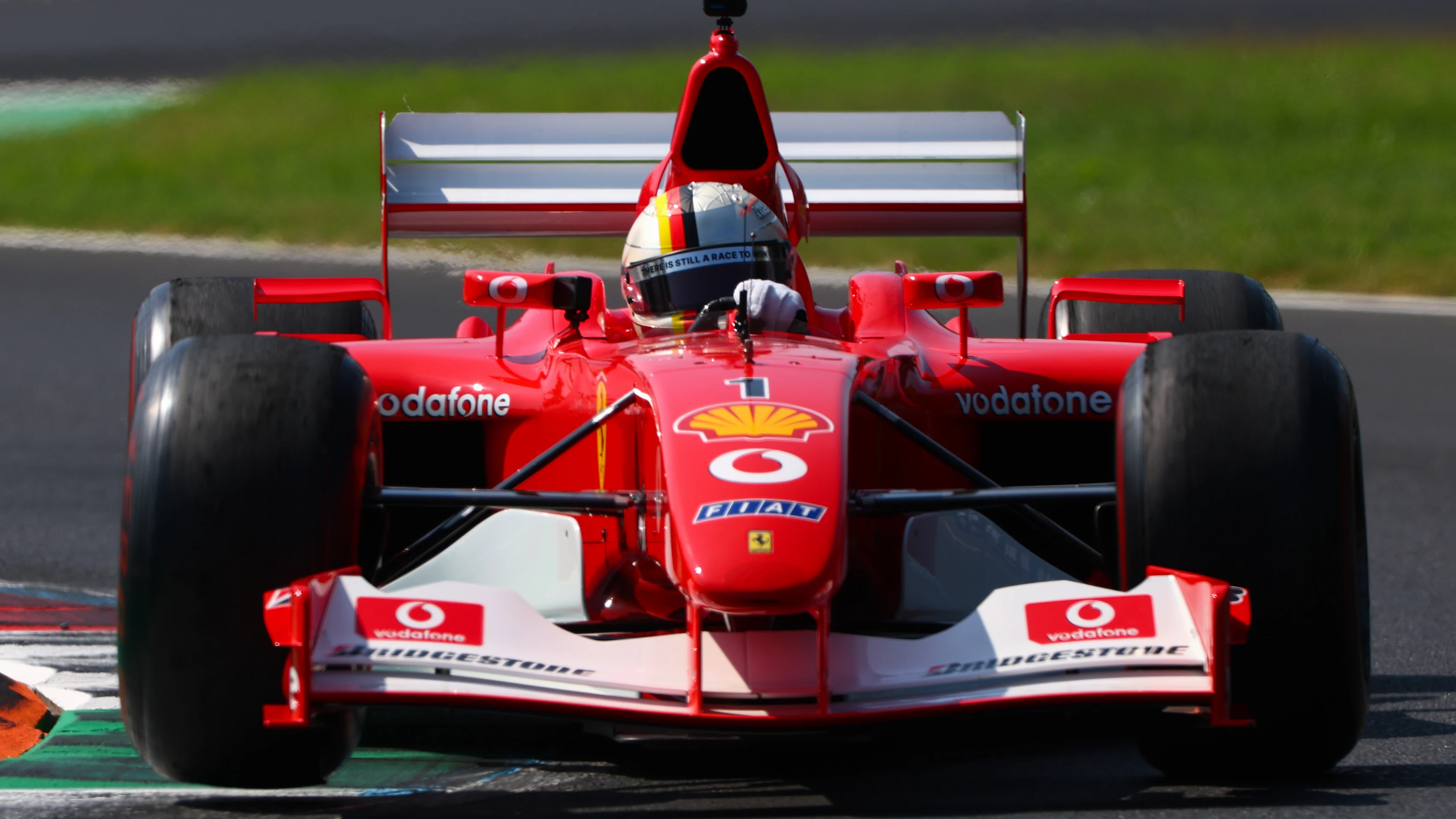 MONZA, ITALY - SEPTEMBER 06: Sebastian Vettel drives a historic Ferrari the Michael Schumacher