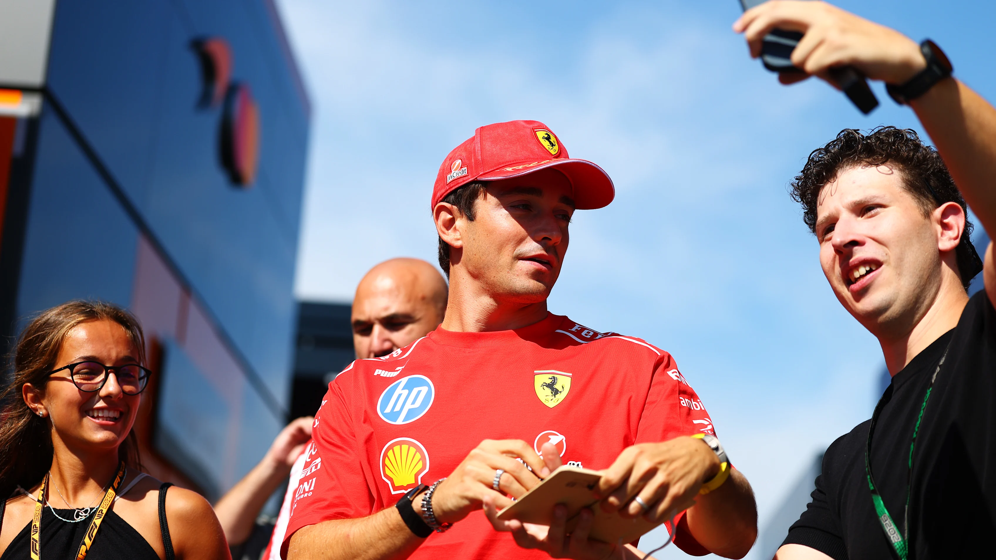 MONZA, ITALY - SEPTEMBER 03: Charles Leclerc of Monaco and Scuderia Ferrari signs autographs for
