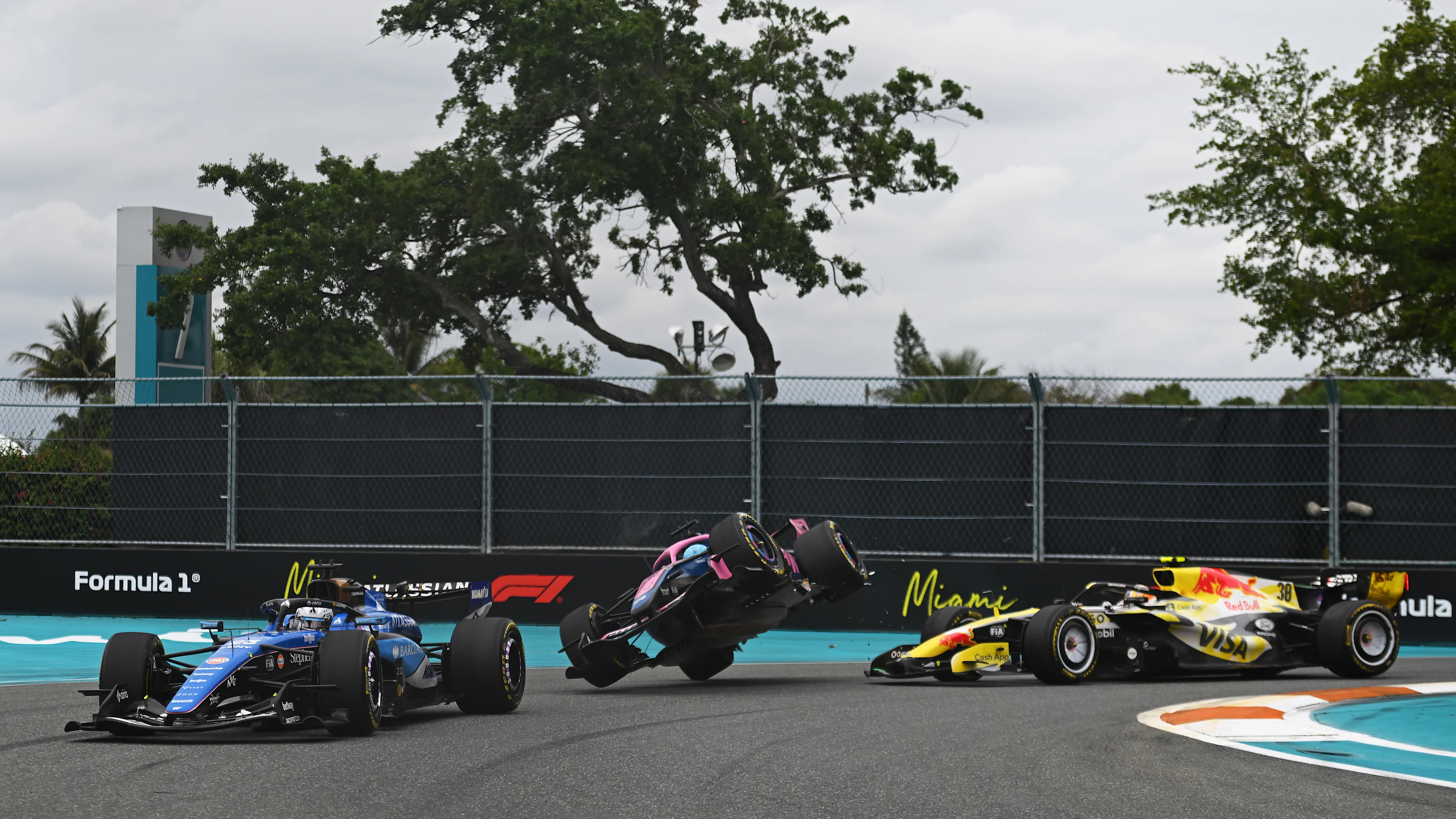 MIAMI, FLORIDA - MAY 03: Alexander Albon of Thailand driving the (23) Williams FW48 Mercedes leads as Pierre Gasly of France driving the (10) Alpine F1 A526 Mercedes and Liam Lawson of New Zealand driving the (30) Visa Cash App Racing Bulls VCARB 03 RB Ford make contact during the F1 Grand Prix of Miami at Miami International Autodrome on May 03, 2026 in Miami, Florida. (Photo by Rudy Carezzevoli/Getty Images)