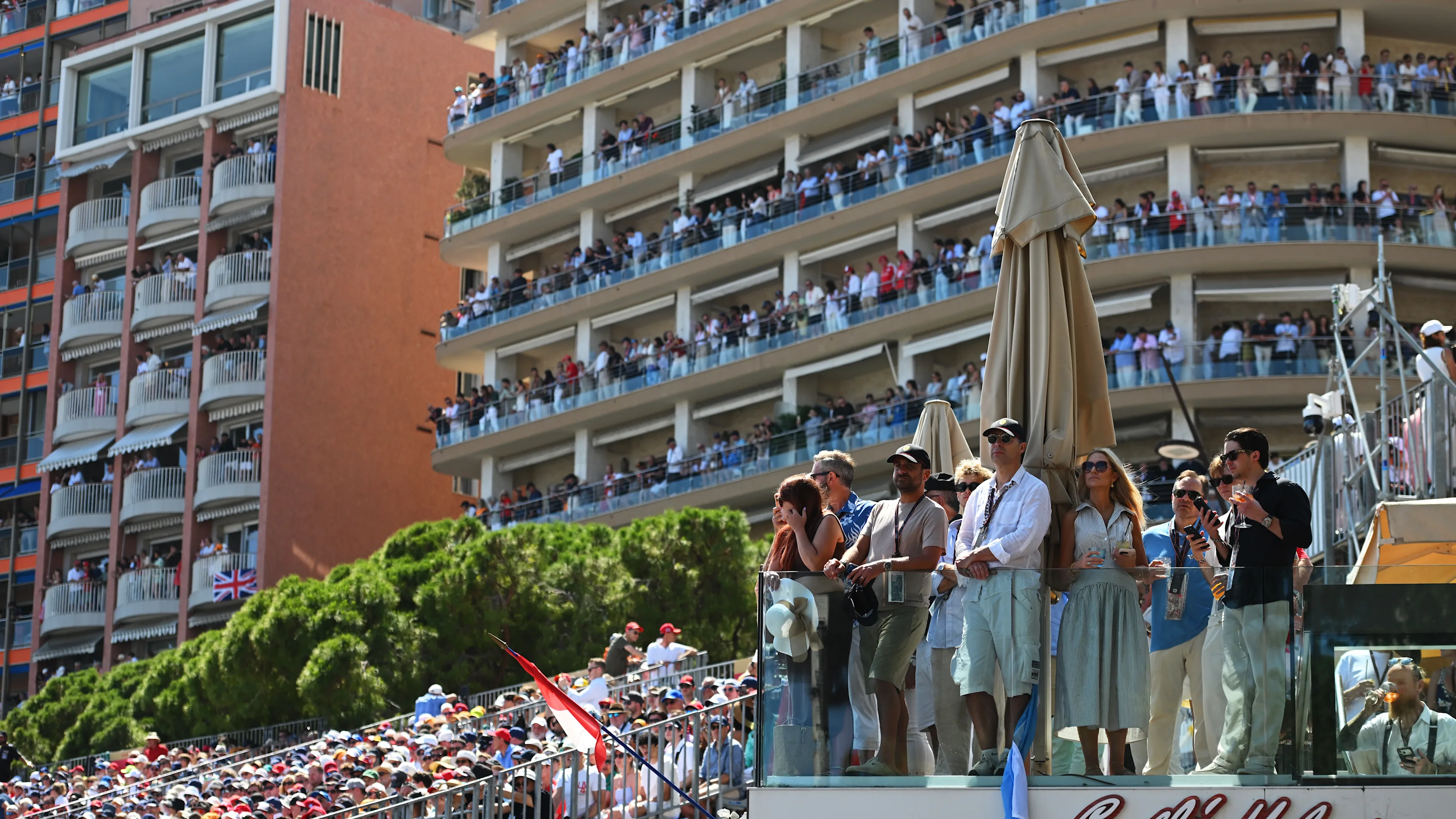 MONTE-CARLO, MONACO - JUNE 07: Guests watch from a balcony during the F1 Grand Prix of Monaco at