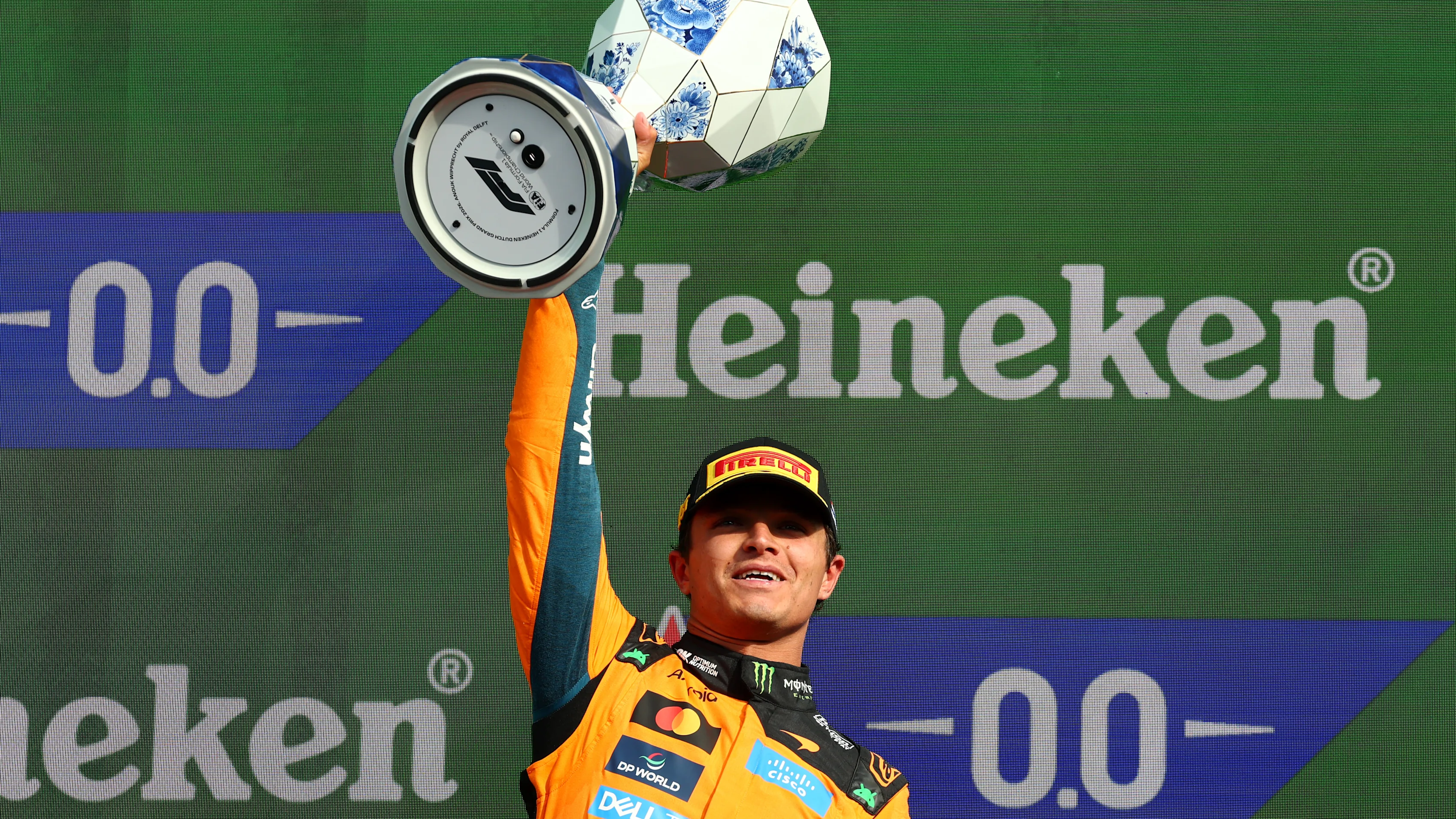 ZANDVOORT, NETHERLANDS - AUGUST 23: Race winner Lando Norris of Great Britain and McLaren lifts his