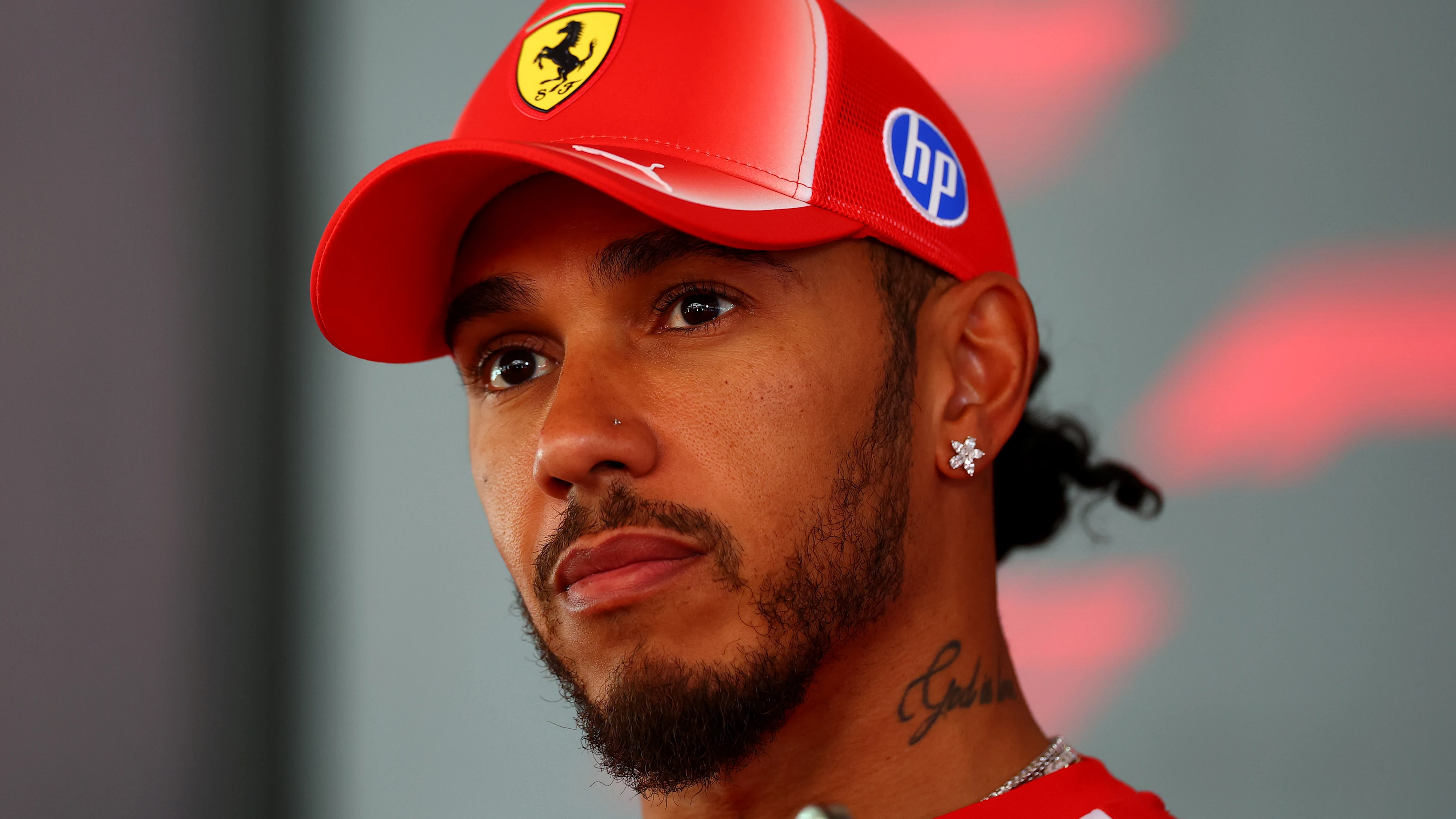 MADRID, SPAIN - SEPTEMBER 10: Lewis Hamilton of Great Britain and Scuderia Ferrari talks to the