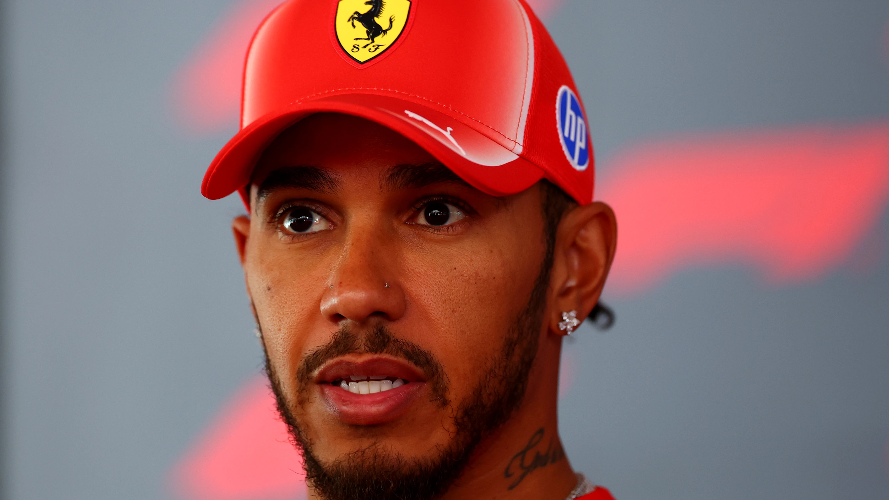 MADRID, SPAIN - SEPTEMBER 10: Lewis Hamilton of Great Britain and Scuderia Ferrari talks to the