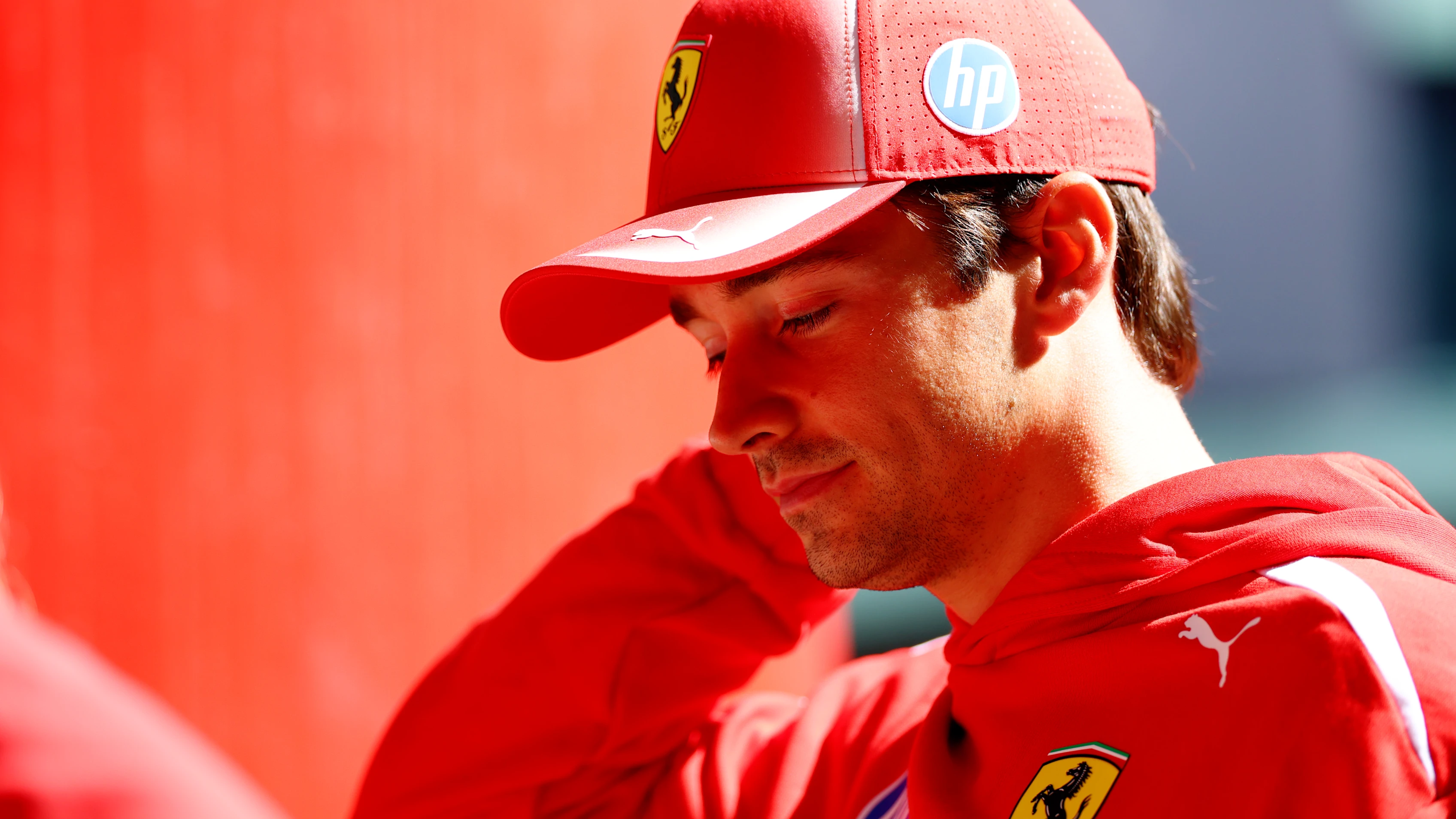 MADRID, SPAIN - SEPTEMBER 10: Charles Leclerc of Monaco and Scuderia Ferrari walks in the Paddock