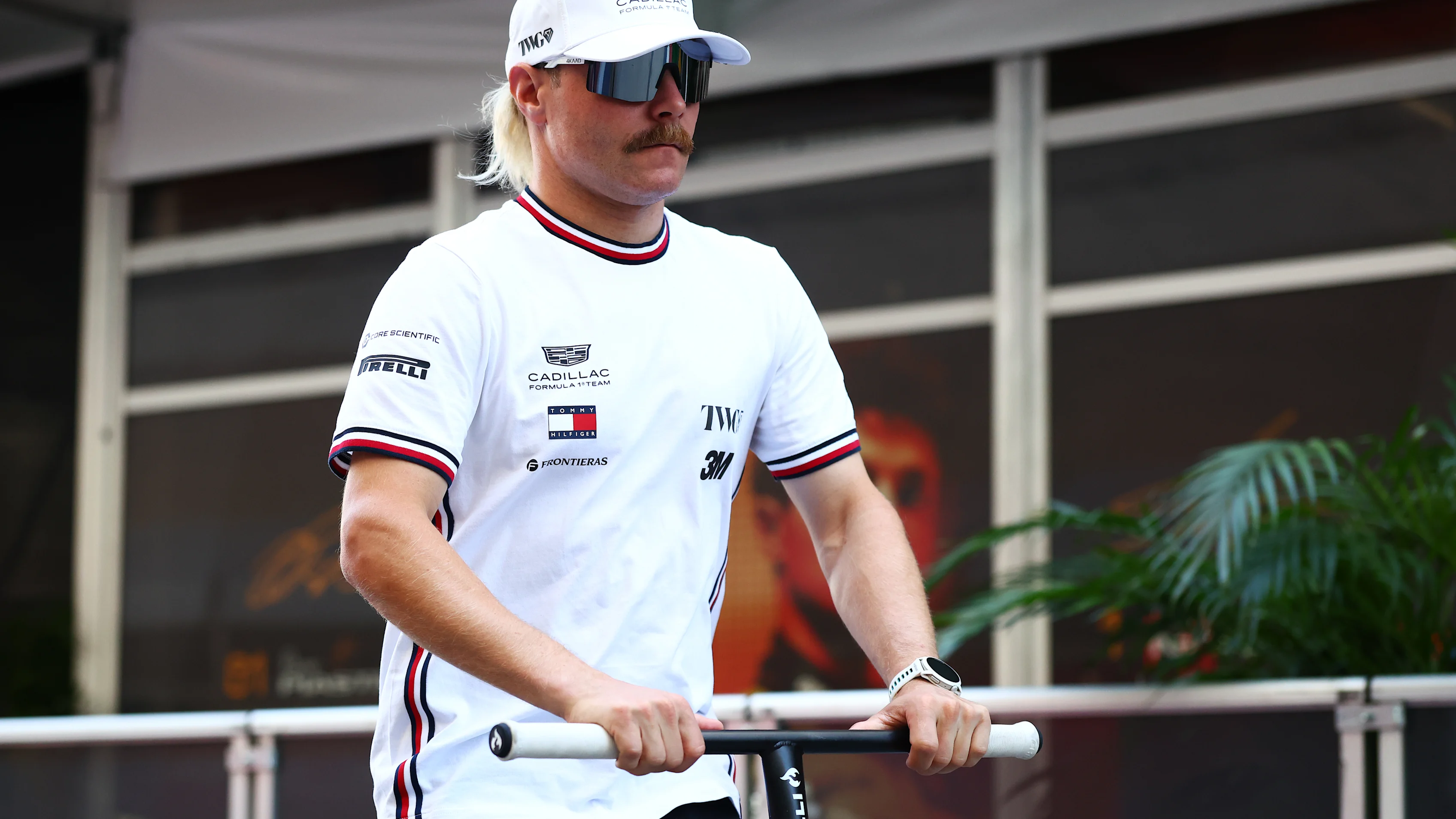 AUSTIN, TEXAS - OCTOBER 22: Valtteri Bottas of Finland and Cadillac F1 Team rides his scooter in