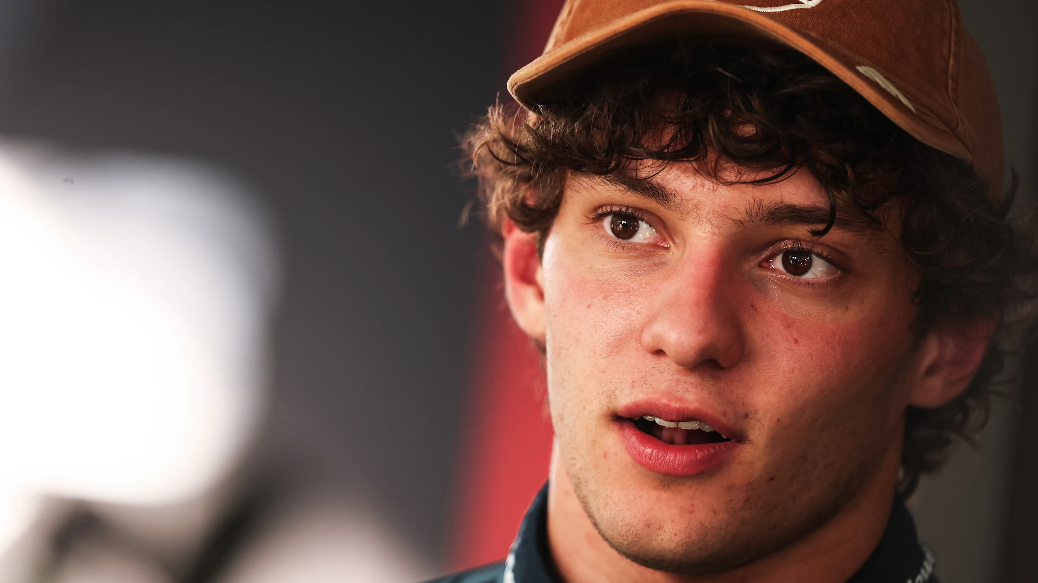 AUSTIN, TEXAS - OCTOBER 23: Gabriel Bortoleto of Brazil and Audi F1 Team arrives in the Paddock