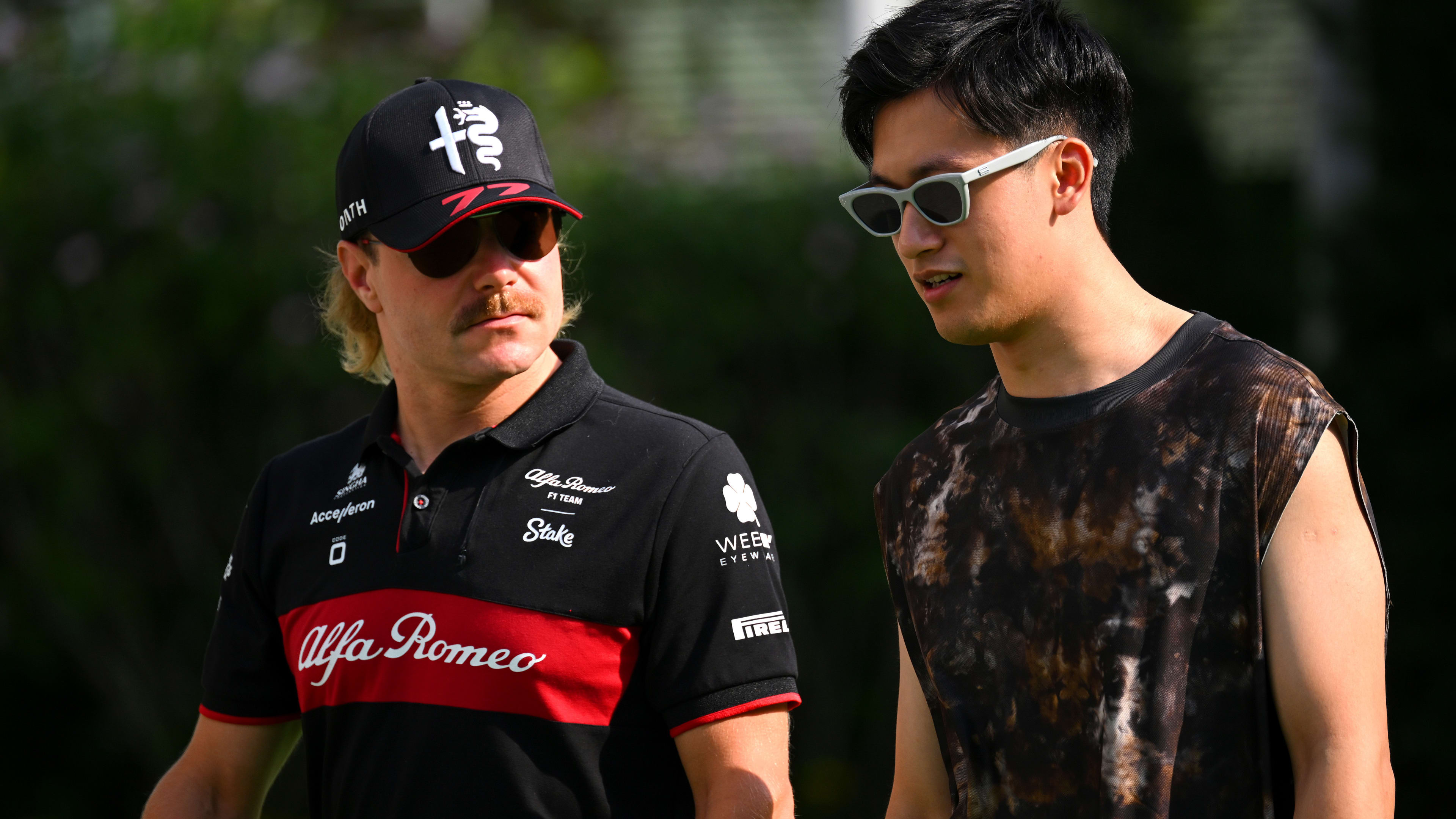 SINGAPORE, SINGAPORE - SEPTEMBER 14: Valtteri Bottas of Finland and Alfa Romeo F1 and Zhou Guanyu