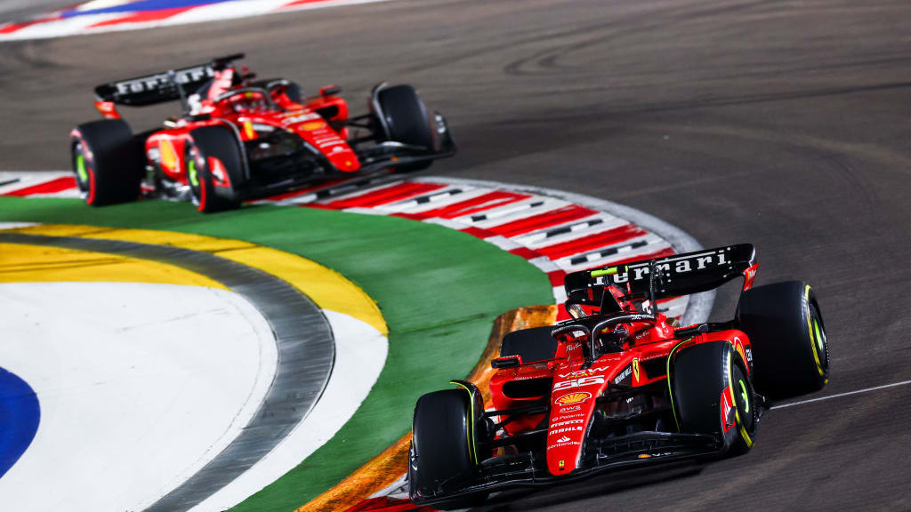 SINGAPORE, SINGAPORE - SEPTEMBER 17: Carlos Sainz of Spain driving (55) the Ferrari SF-23 leads