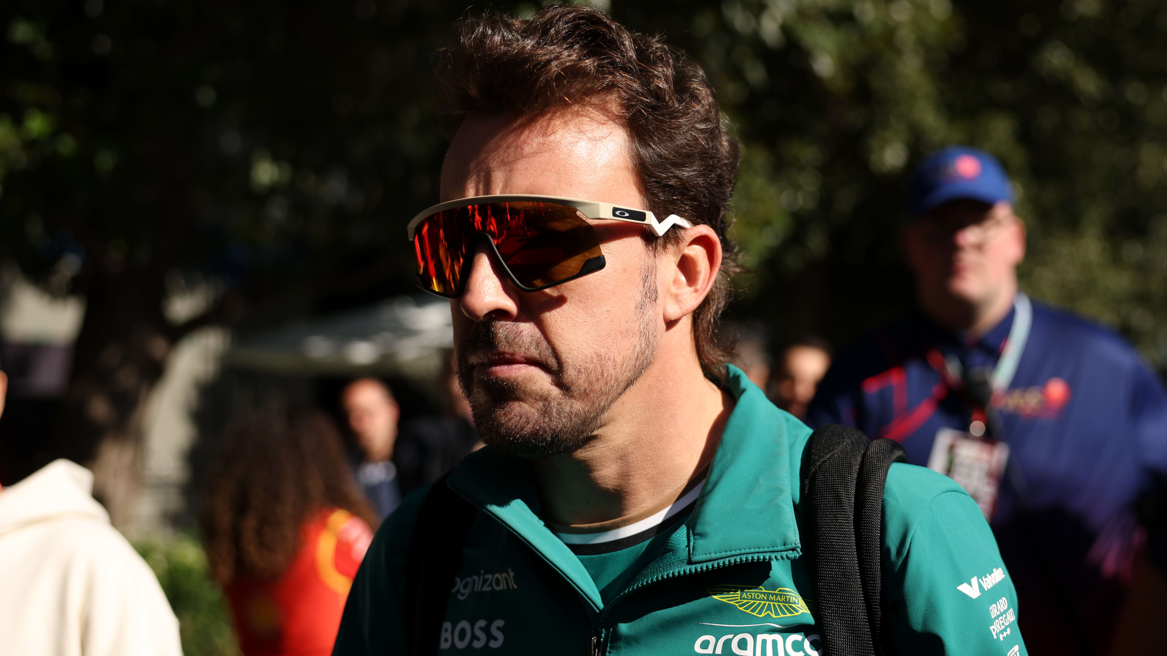 MELBOURNE, AUSTRALIA - MARCH 22: Fernando Alonso of Spain and Aston Martin F1 Team walks in the
