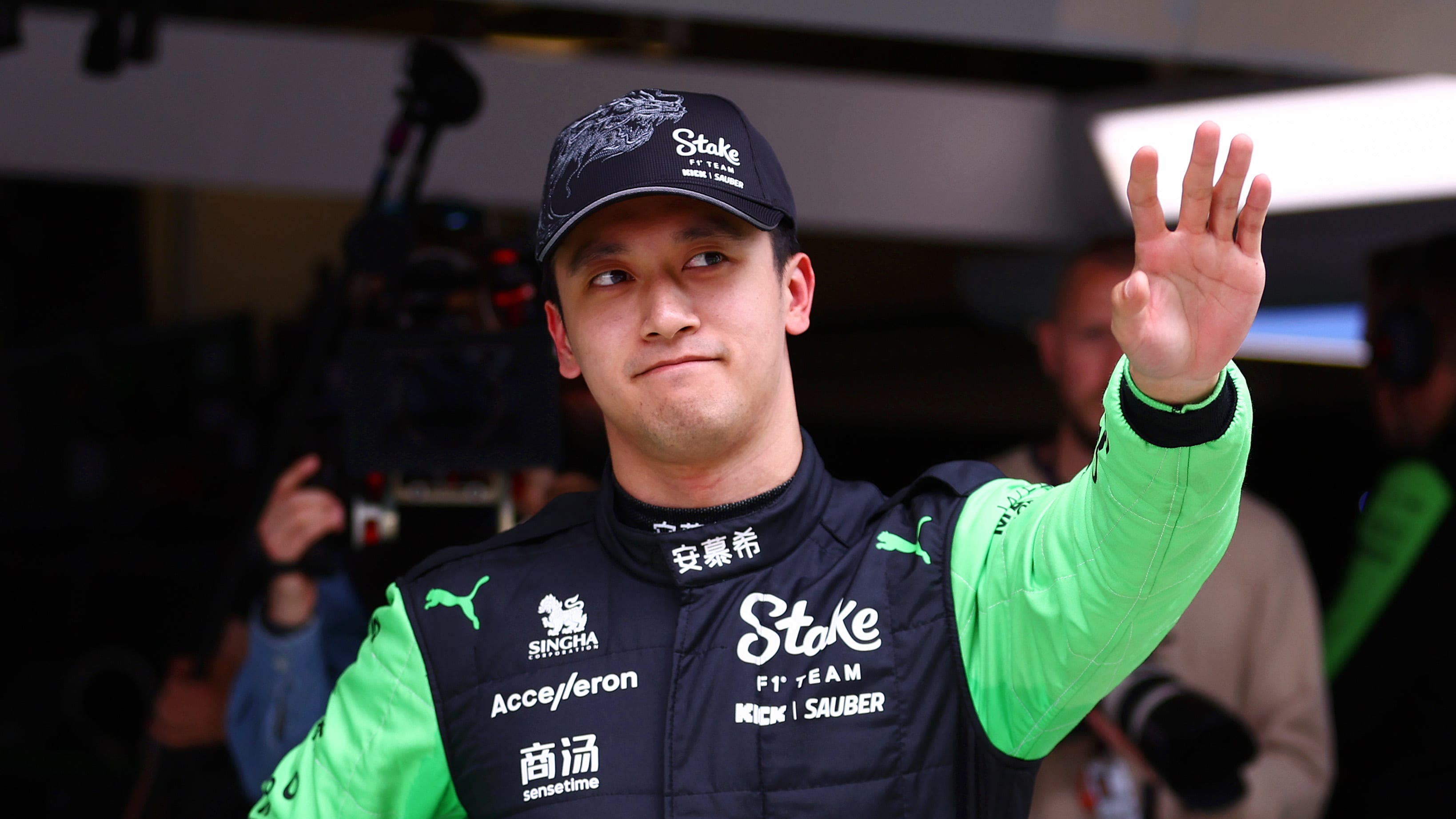SHANGHAI, CHINA - APRIL 19: Zhou Guanyu of China and Stake F1 Team Kick Sauber waves to fans ahead
