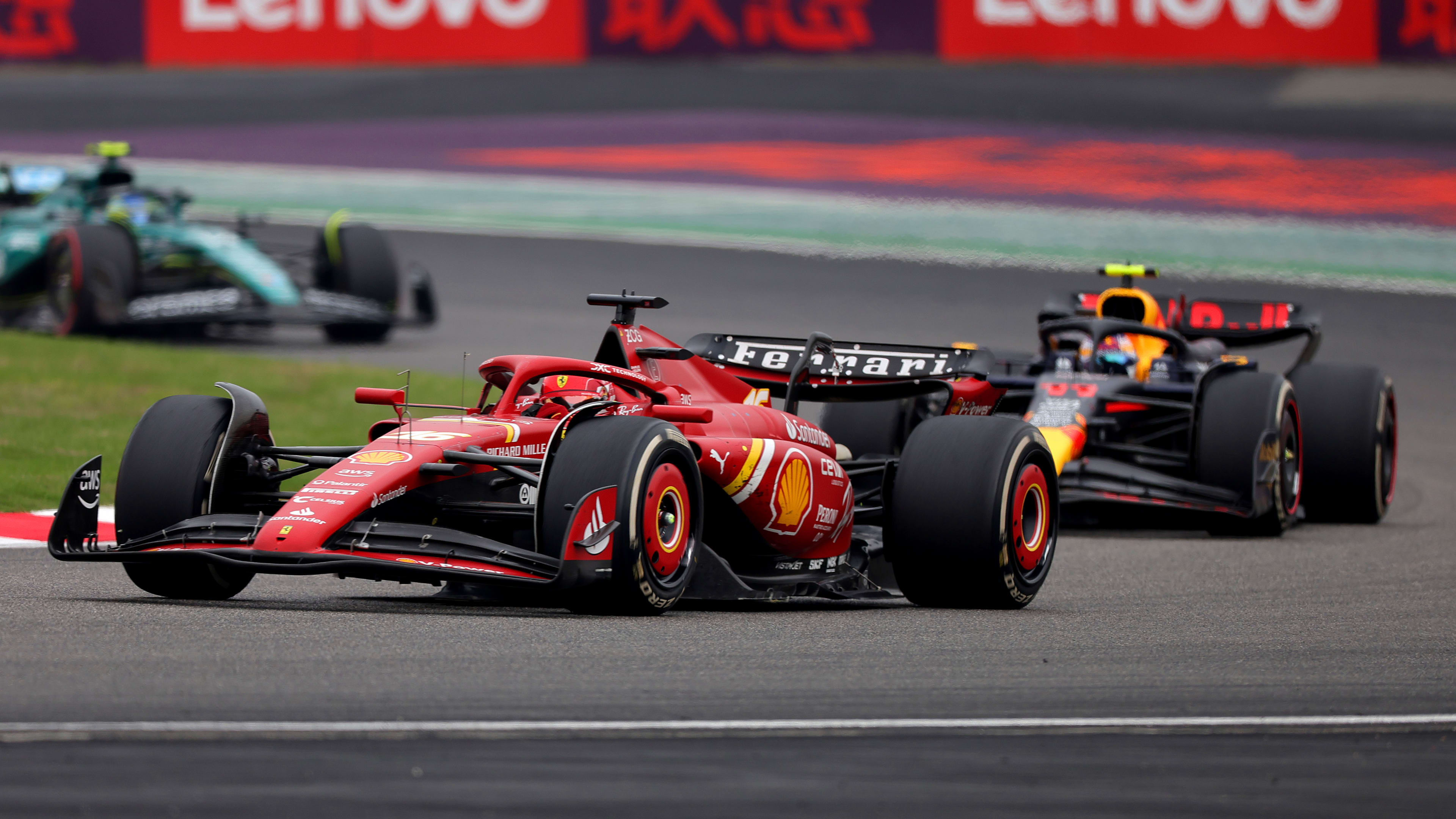 SHANGHAI, CHINA - APRIL 21: Charles Leclerc of Monaco driving the (16) Ferrari SF-24 leads Sergio