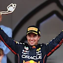 MONTE-CARLO, MONACO - MAY 29: Race winner Sergio Perez of Mexico and Oracle Red Bull Racing celebrates on the podium during the F1 Grand Prix of Monaco at Circuit de Monaco on May 29, 2022 in Monte-Carlo, Monaco. (Photo by Clive Rose/Getty Images)