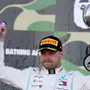 SUZUKA, JAPAN - OCTOBER 13: Race winner Valtteri Bottas of Finland and Mercedes GP celebrates on the podium during the F1 Grand Prix of Japan at Suzuka Circuit on October 13, 2019 in Suzuka, Japan. (Photo by Charles Coates/Getty Images)