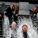 2014: Red Bull drivers Vettel and Daniel Ricciardo pour buckets of ice water over Horner and Newey