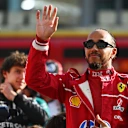 ABU DHABI, UNITED ARAB EMIRATES - DECEMBER 07: Lewis Hamilton of Great Britain and Scuderia Ferrari waves at the 2025 F1 drivers photo call prior to the F1 Grand Prix of Abu Dhabi at Yas Marina Circuit on December 07, 2025 in Abu Dhabi, United Arab Emirates. (Photo by Rudy Carezzevoli/Getty Images)