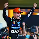 ABU DHABI, UNITED ARAB EMIRATES - DECEMBER 07: 2025 F1 World Drivers Champion Lando Norris of Great Britain and McLaren celebrates with his team during the F1 Grand Prix of Abu Dhabi at Yas Marina Circuit on December 07, 2025 in Abu Dhabi, United Arab Emirates. (Photo by Bryn Lennon - Formula 1/Formula 1 via Getty Images)