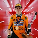 SPA, BELGIUM - JULY 27: Race winner Oscar Piastri of Australia and McLaren leaves the podium with his trophy and Champagne during the F1 Grand Prix of Belgium at Circuit de Spa-Francorchamps on July 27, 2025 in Spa, Belgium. (Photo by Mark Sutton - Formula 1/Formula 1 via Getty Images)