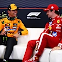 SPA, BELGIUM - JULY 26: Pole position qualifier Lando Norris of Great Britain and McLaren and Third placed qualifier Charles Leclerc of Monaco and Scuderia Ferrari talk in the Drivers Press Conference during qualifying ahead of the F1 Grand Prix of Belgium at Circuit de Spa-Francorchamps on July 26, 2025 in Spa, Belgium. (Photo by Clive Rose/Getty Images)
