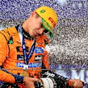 SAO PAULO, BRAZIL - NOVEMBER 09: Race winner Lando Norris of Great Britain and McLaren sprays the victory Champagne on the podium during the F1 Grand Prix of Brazil at Autodromo Jose Carlos Pace on November 09, 2025 in Sao Paulo, Brazil. (Photo by Buda Mendes/Getty Images)