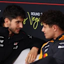 LAS VEGAS, NEVADA - NOVEMBER 19: Esteban Ocon of France and Haas F1 talks with Lando Norris of Great Britain and McLaren in the Drivers Press Conference during previews ahead of the F1 Grand Prix of Las Vegas at Las Vegas Strip Circuit on November 19, 2025 in Las Vegas, Nevada. (Photo by Clive Rose/Getty Images)