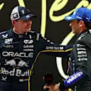 LAS VEGAS, NEVADA - NOVEMBER 21: Second placed qualifier Max Verstappen of the Netherlands and Oracle Red Bull Racing and Third placed qualifier Carlos Sainz of Spain and Williams talk in parc ferme during qualifying ahead of the F1 Grand Prix of Las Vegas at Las Vegas Strip Circuit on November 21, 2025 in Las Vegas, Nevada. (Photo by Mark Thompson/Getty Images)