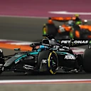 LUSAIL CITY, QATAR - NOVEMBER 29: George Russell of Great Britain driving the (63) Mercedes AMG Petronas F1 Team W16 leads Lando Norris of Great Britain driving the (4) McLaren MCL39 Mercedes on track during the Sprint ahead of the F1 Grand Prix of Qatar at Lusail International Circuit on November 29, 2025 in Lusail City, Qatar. (Photo by Clive Rose - Formula 1/Formula 1 via Getty Images)