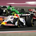 LUSAIL CITY, QATAR - NOVEMBER 29: Liam Lawson of New Zealand driving the (30) Visa Cash App Racing Bulls VCARB 02 leads Esteban Ocon of France driving the (31) Haas F1 VF-25 Ferrari and Nico Hulkenberg of Germany driving the (27) Kick Sauber C45 Ferrari on track during the Sprint ahead of the F1 Grand Prix of Qatar at Lusail International Circuit on November 29, 2025 in Lusail City, Qatar. (Photo by Clive Rose - Formula 1/Formula 1 via Getty Images)