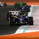 LUSAIL CITY, QATAR - NOVEMBER 29: Carlos Sainz of Spain driving the (55) Williams FW47 Mercedes leads Isack Hadjar of France driving the (6) Visa Cash App Racing Bulls VCARB 02 on track during the Sprint ahead of the F1 Grand Prix of Qatar at Lusail International Circuit on November 29, 2025 in Lusail City, Qatar. (Photo by Clive Mason/Getty Images)