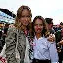 Olivia Wilde and Felicity Jones on the grid before the race 