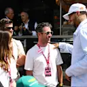 Cyclist Mark Cavendish chats with US fencer Miles Chamley-Watson in the Paddock during FP3 in Monaco
