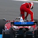 ZANDVOORT, NETHERLANDS - AUGUST 31: Charles Leclerc of Monaco and Scuderia Ferrari climbs out of his damaged car after a crash during the F1 Grand Prix of Netherlands at Circuit Zandvoort on August 31, 2025 in Zandvoort, Netherlands. (Photo by Zak Mauger/LAT Images)