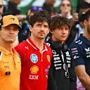 SHANGHAI, CHINA - MARCH 23: Lando Norris of Great Britain and McLaren, Charles Leclerc of Monaco