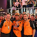 SINGAPORE, SINGAPORE - OCTOBER 05: Zak Brown, Chief Executive Officer of McLaren, Third placed Lando Norris of Great Britain and McLaren and Andrea Stella, Team Principal of McLaren celebrate winning the 2025 World Constructors Championship in parc ferme during the F1 Grand Prix of Singapore at Marina Bay Street Circuit on October 05, 2025 in Singapore, Singapore. (Photo by Mark Sutton - Formula 1/Formula 1 via Getty Images)