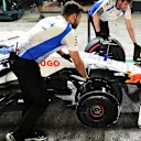 SINGAPORE, SINGAPORE - OCTOBER 03: Mechanics with the damaged car of Liam Lawson of New Zealand driving the (30) Visa Cash App Racing Bulls VCARB 02 in the Pitlane during practice ahead of the F1 Grand Prix of Singapore at Marina Bay Street Circuit on October 03, 2025 in Singapore, Singapore. (Photo by Mark Sutton - Formula 1/Formula 1 via Getty Images)